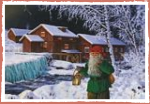 Weihnachtsmann (Tomten) am Bach beim Wasserrad